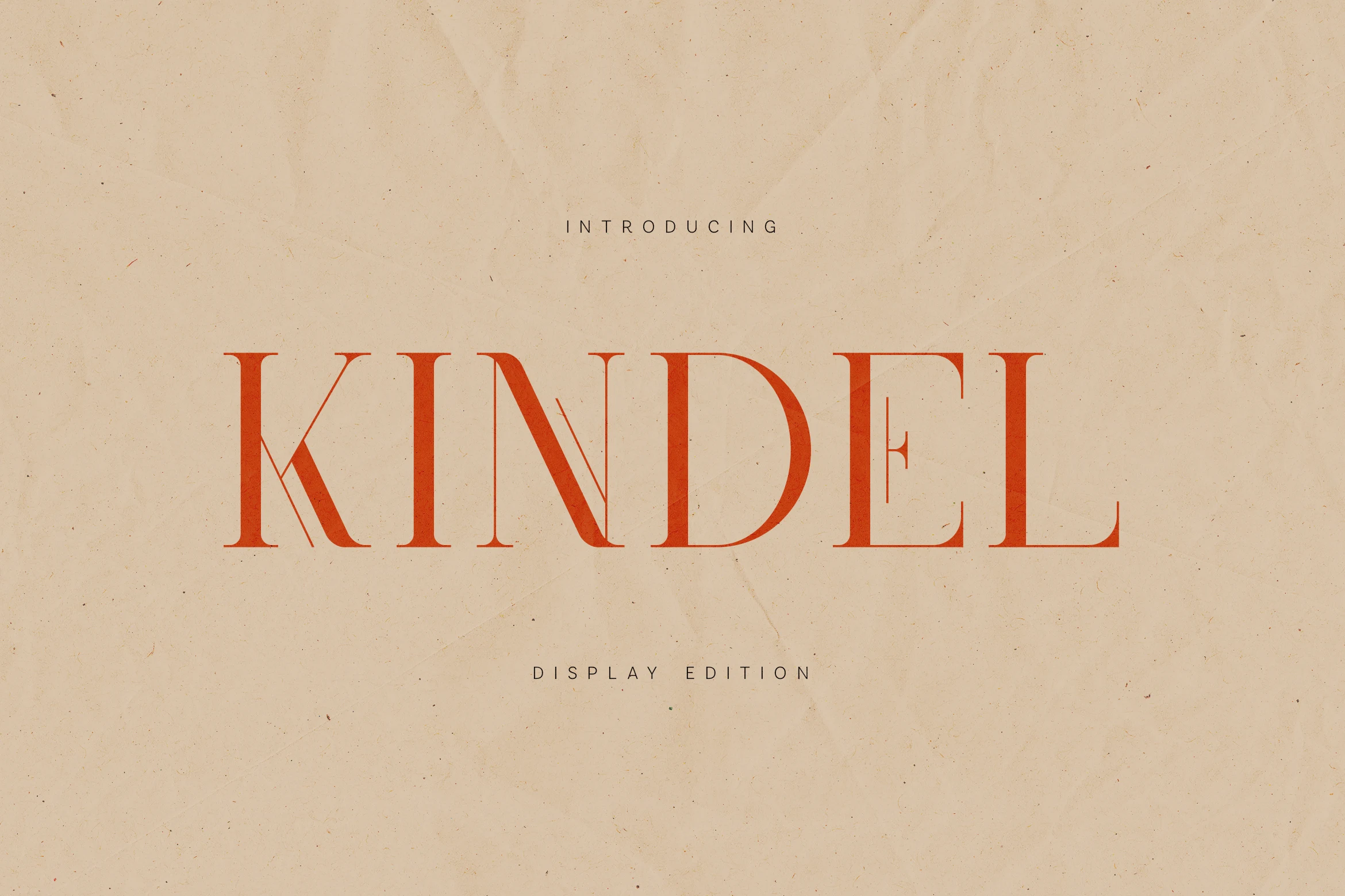 Kindel Display Edition Font preview with thin high-contrast red serif lettering and elegant capitals