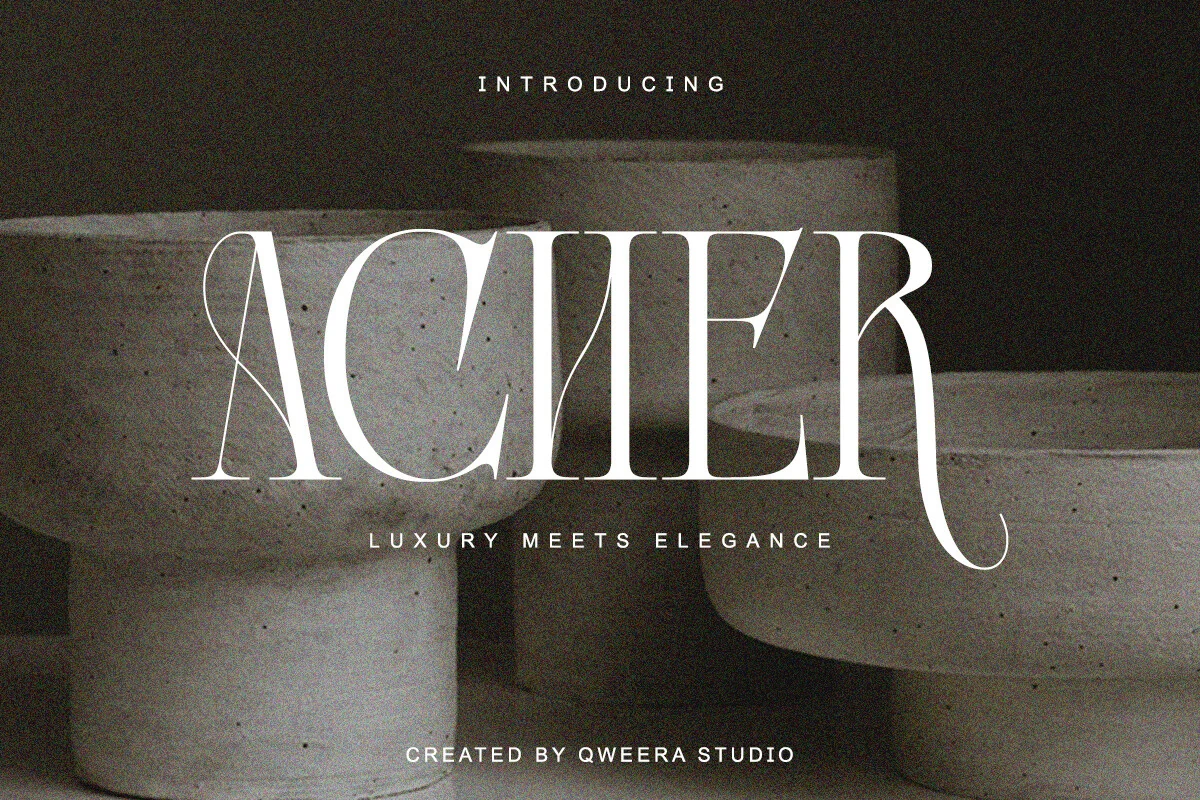 Acher Font preview with white high-contrast serif lettering and a long curled terminal on a dark background