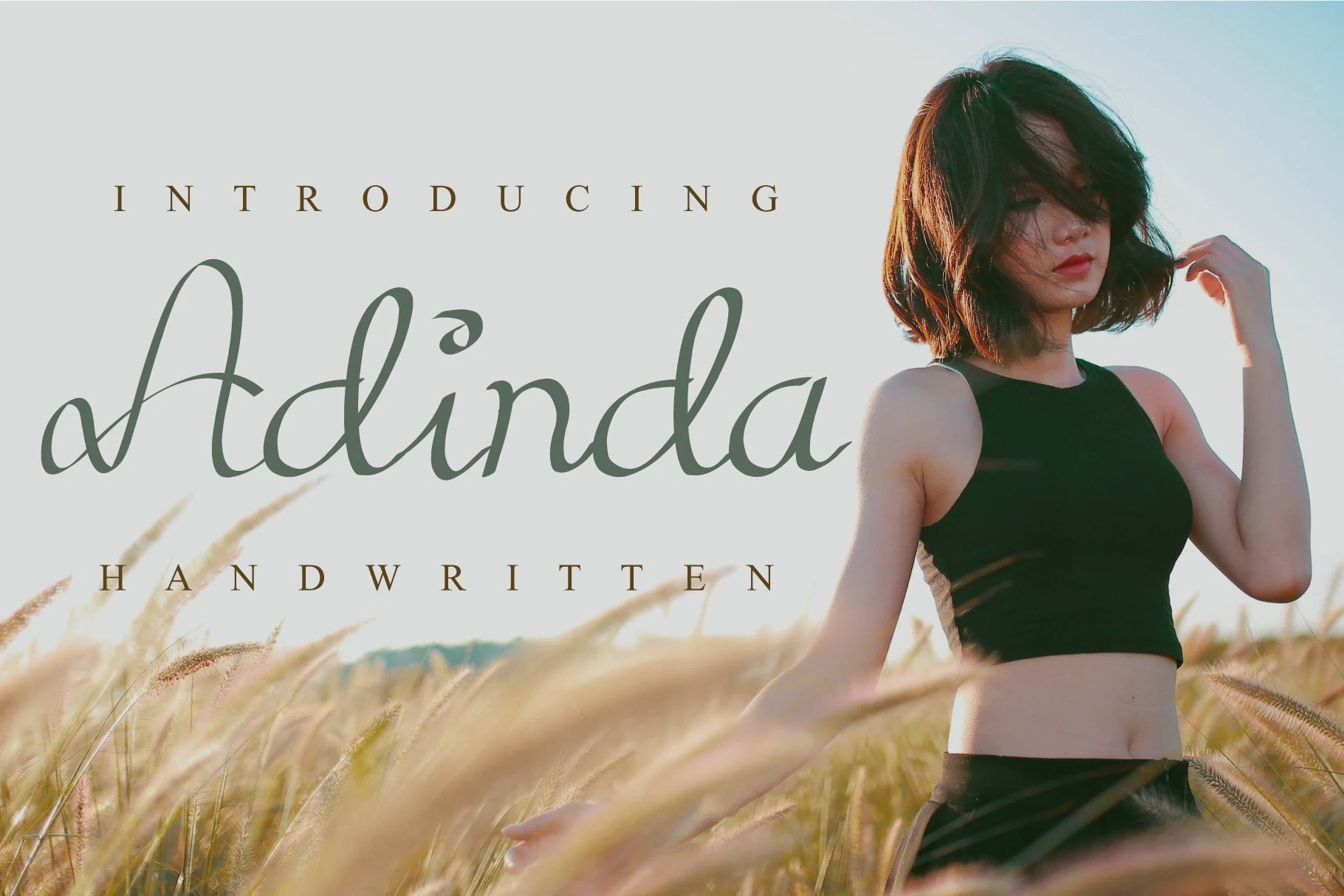 Adinda Font preview with thin looping handwritten script lettering