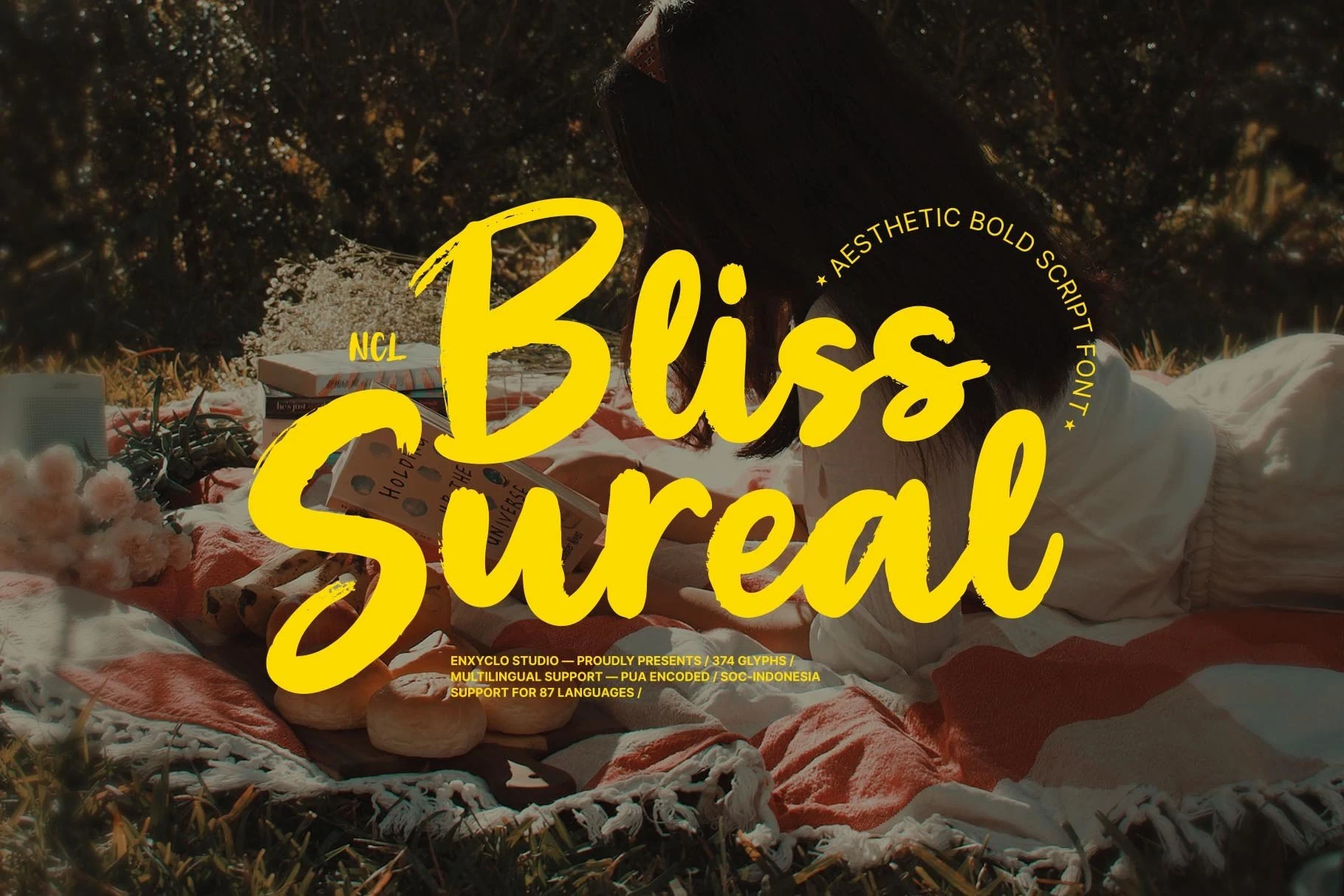 Bliss Sureal Font bold yellow brush script with rounded flowing letters