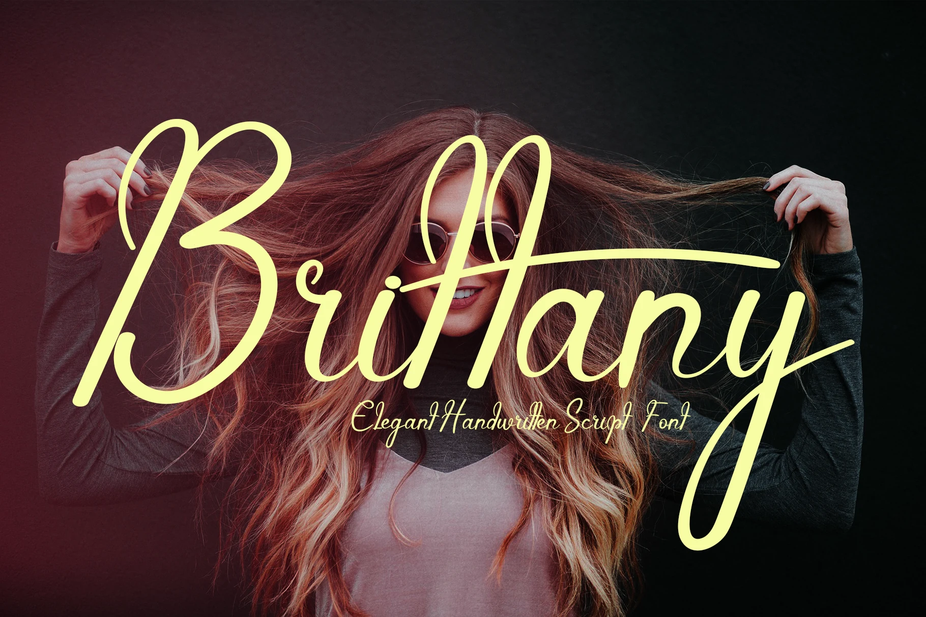 Brittany Font pale yellow handwritten script with tall loops and long flowing swashes