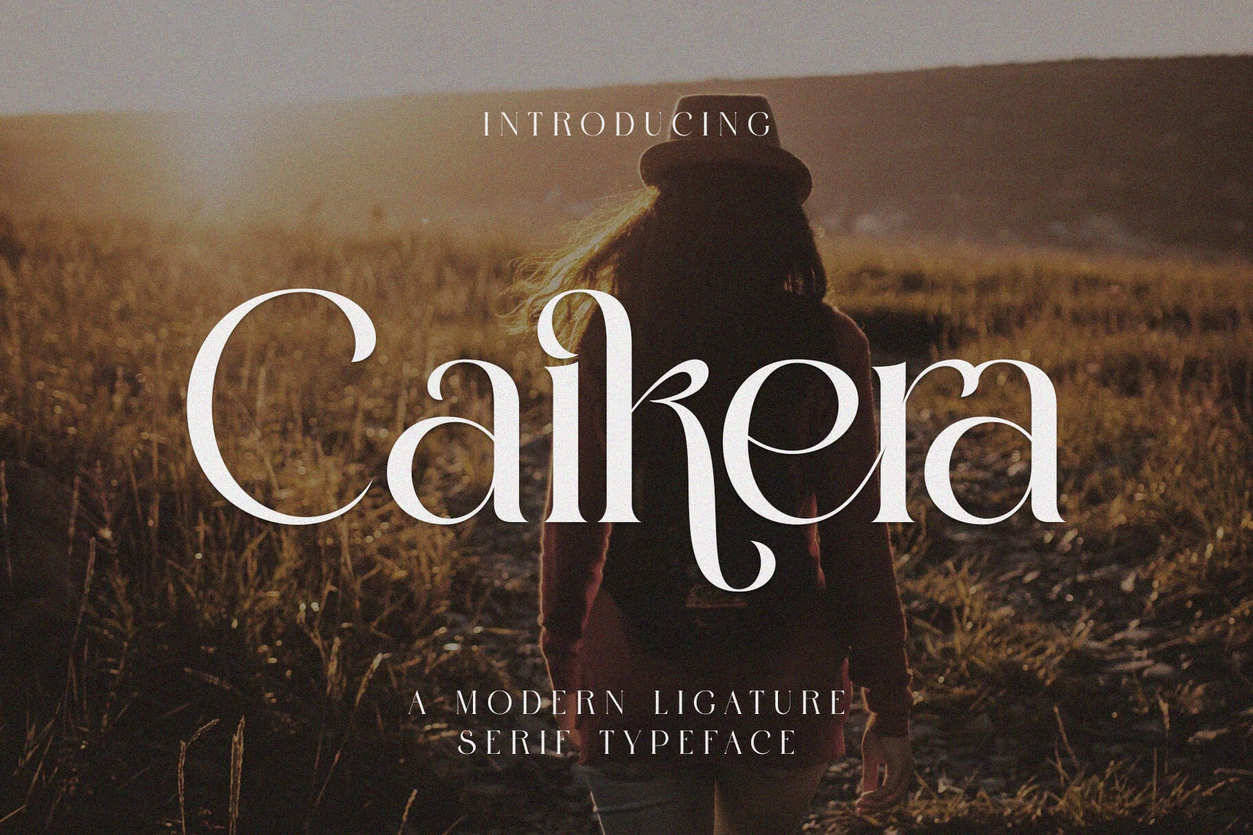 Caikera Font preview with elegant white serif lettering, high contrast, and graceful ligature details