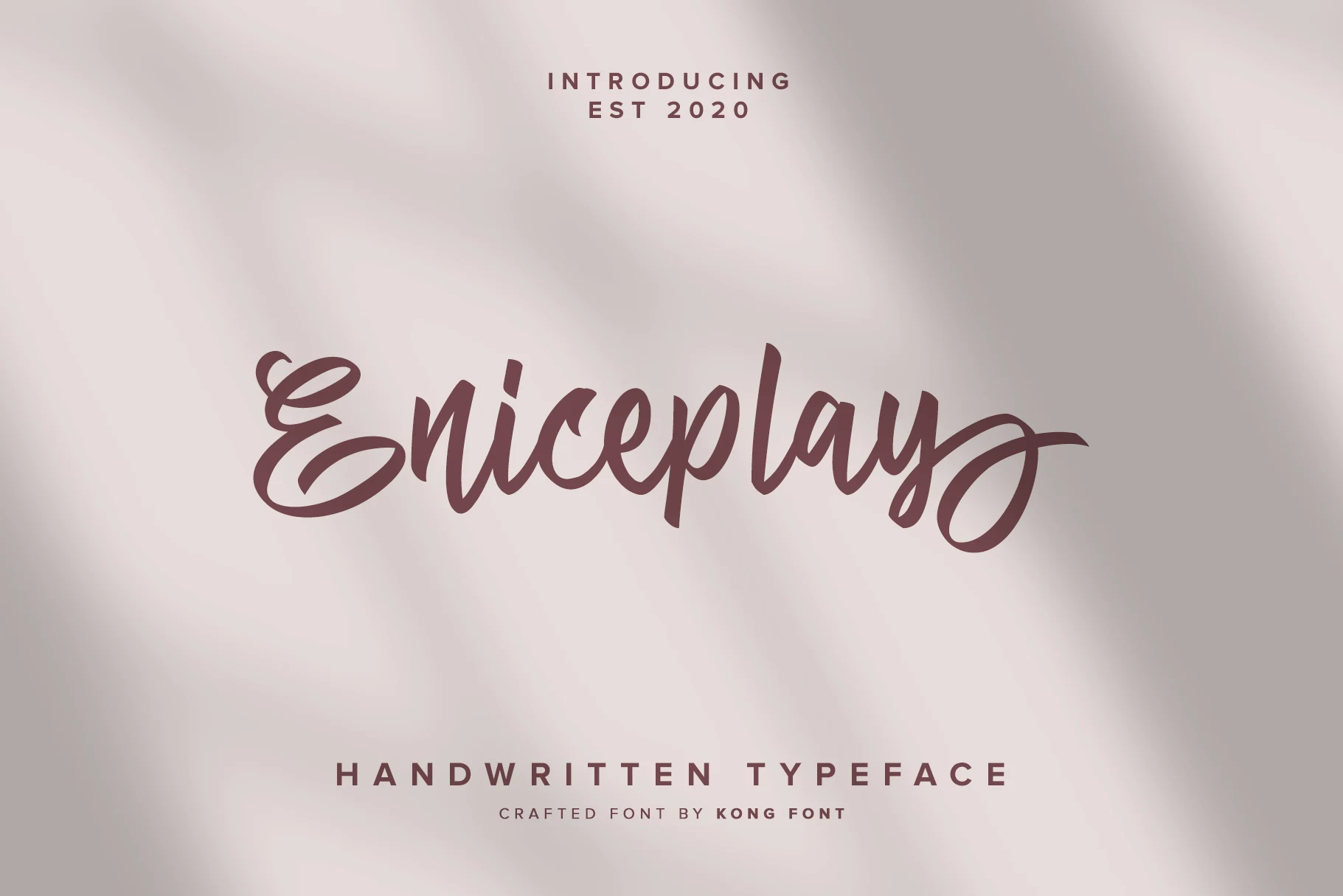Eniceplay Font preview in bold mauve handwritten script with looping swashes