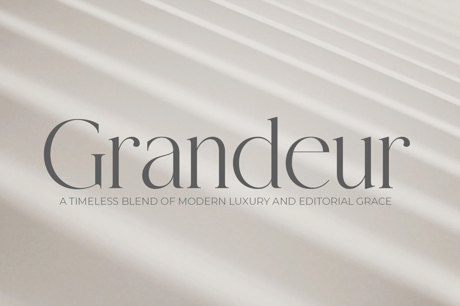 Grandeur – Elegant Classic Serif Font preview with refined gray serif lettering and airy editorial spacing