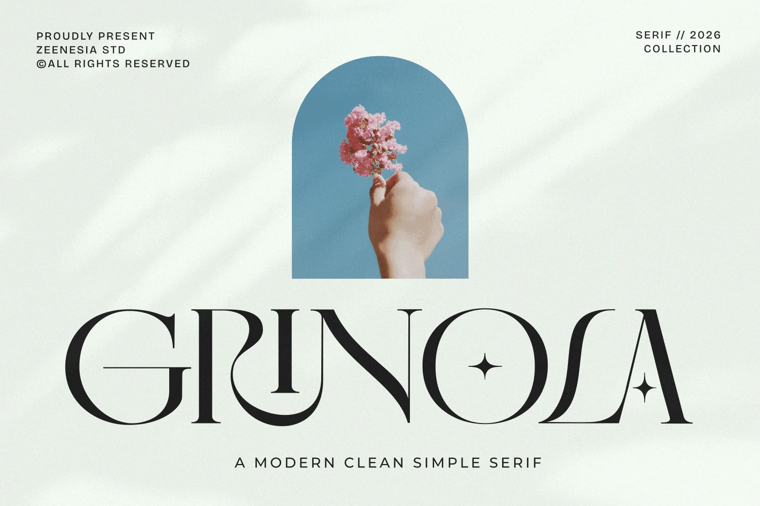 Grinola Font preview with black clean serif lettering, high contrast strokes, and refined decorative details