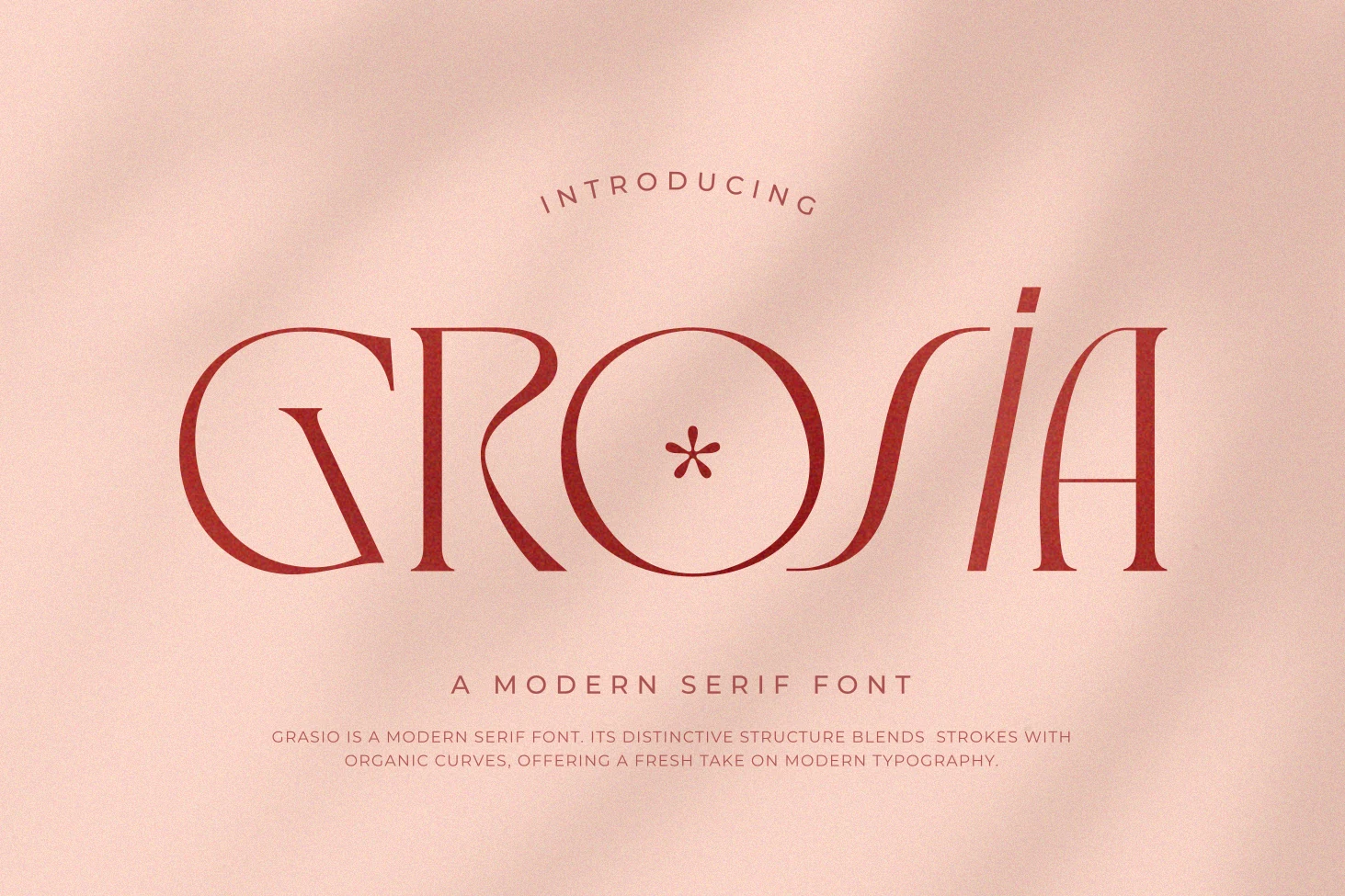 Grosia Font preview in textured red serif lettering with organic curves on a soft pink background