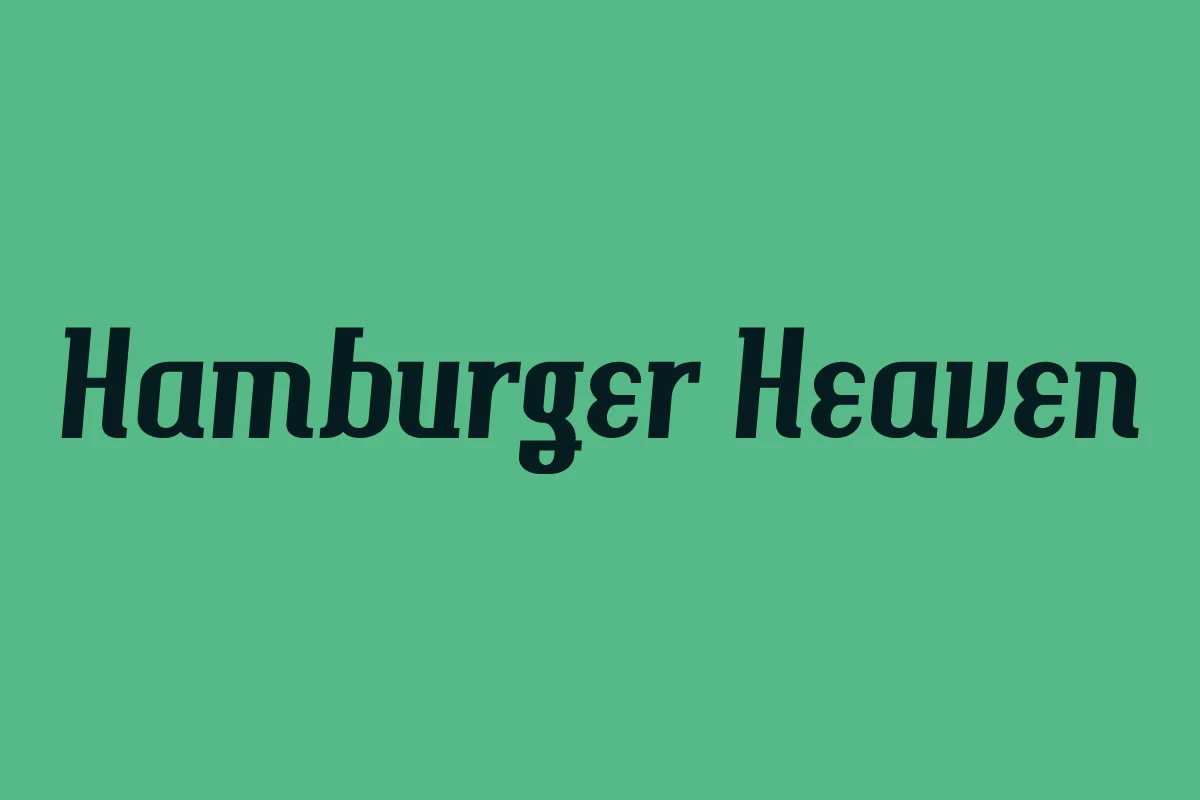Hamburger Heaven Font dark vintage serif lettering with a slanted retro style on a mint green background