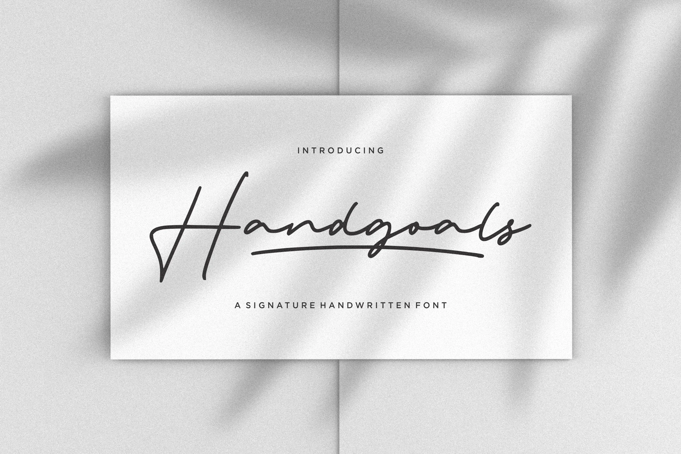 Handgoals Font preview showing slim black signature script with a long underline swash on a light textured background