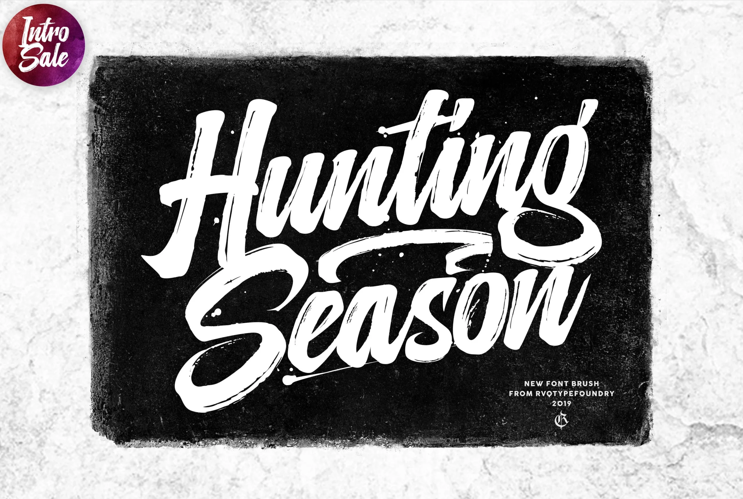 Hunting Season Font preview in bold white brush script with textured strokes