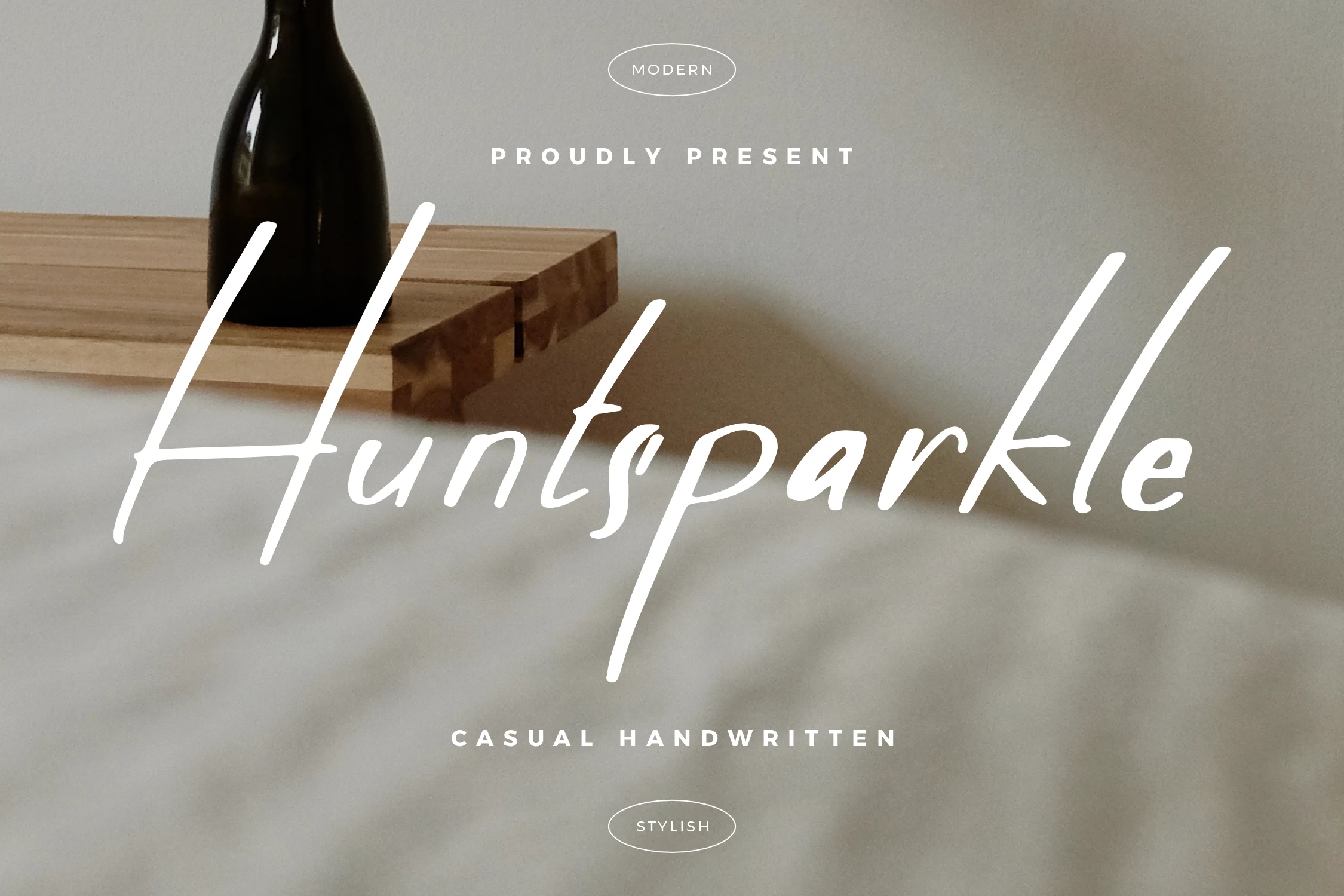 Huntsparkle Font preview in thin white casual handwritten script