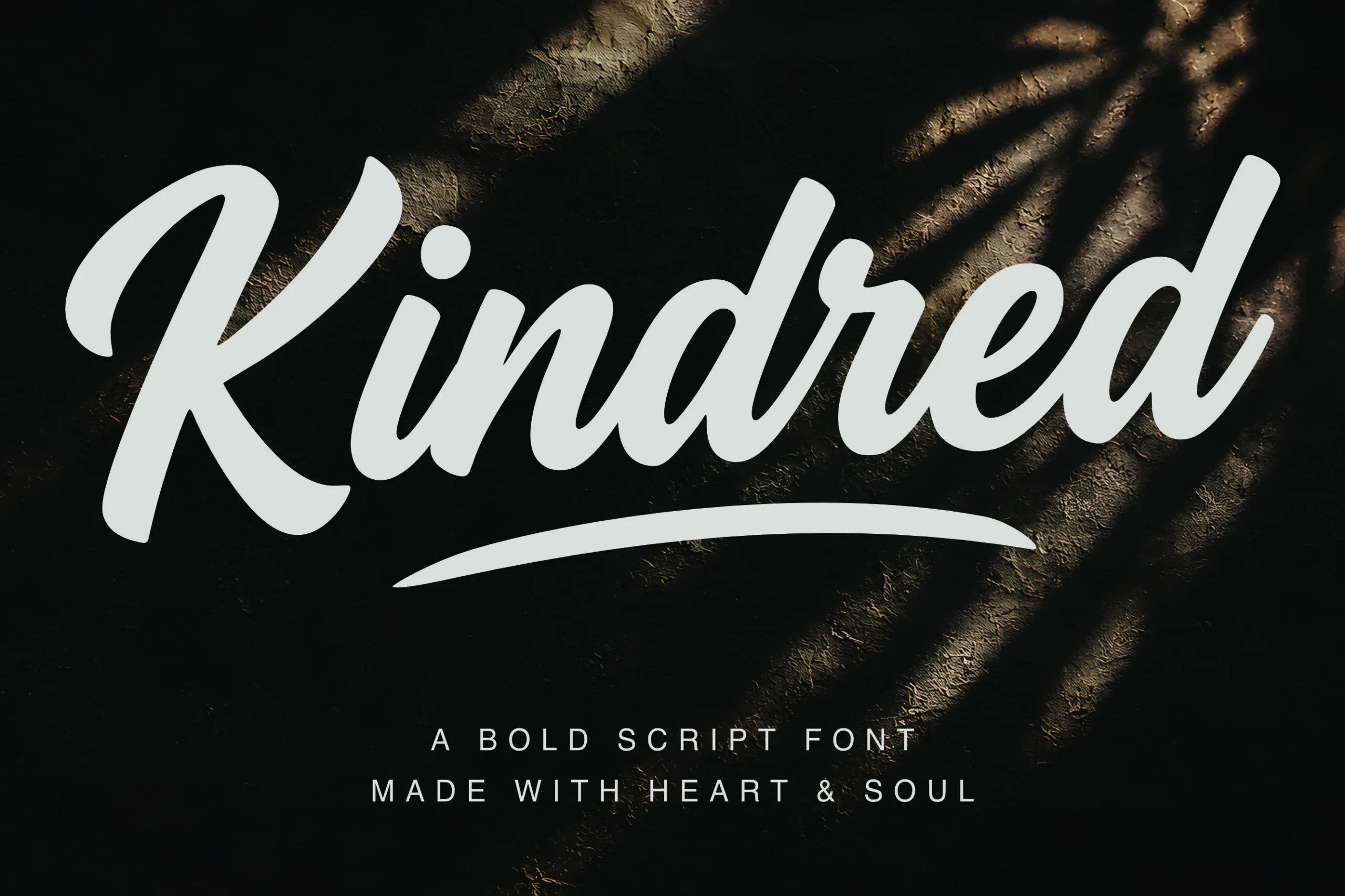 Kindred Font preview in bold white handwritten script with a sweeping underline