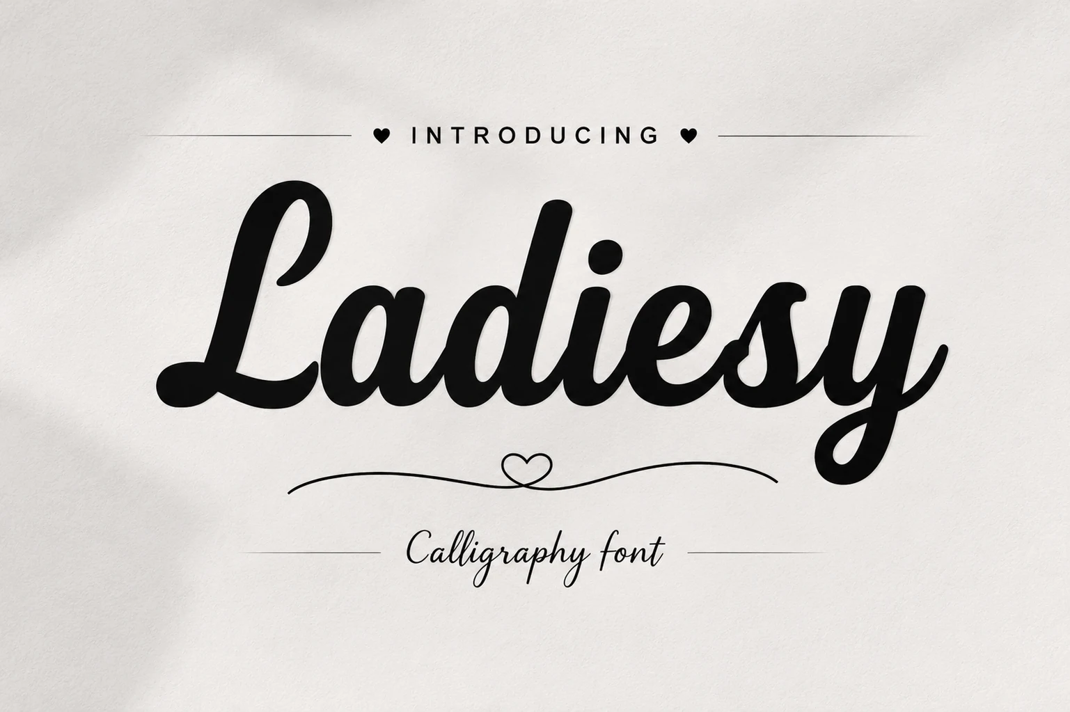 Ladiesy Font preview in bold black calligraphy script with rounded connected strokes