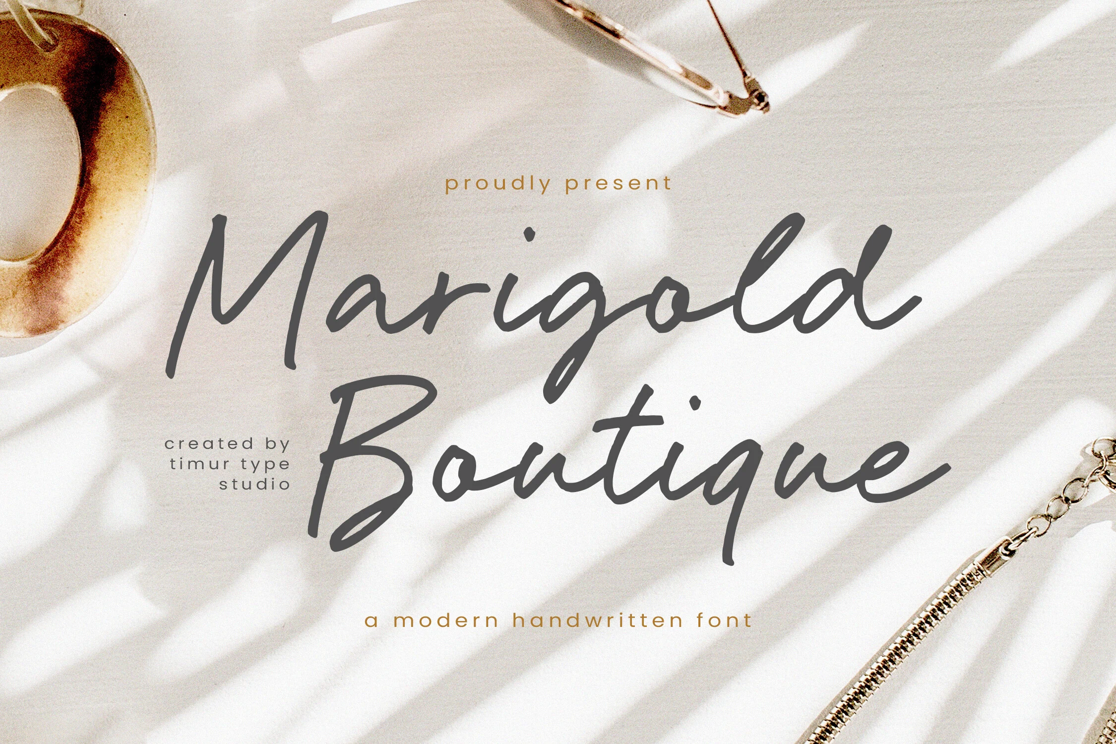 Marigold Boutique Font gray modern handwritten script with tall flowing strokes for logo design