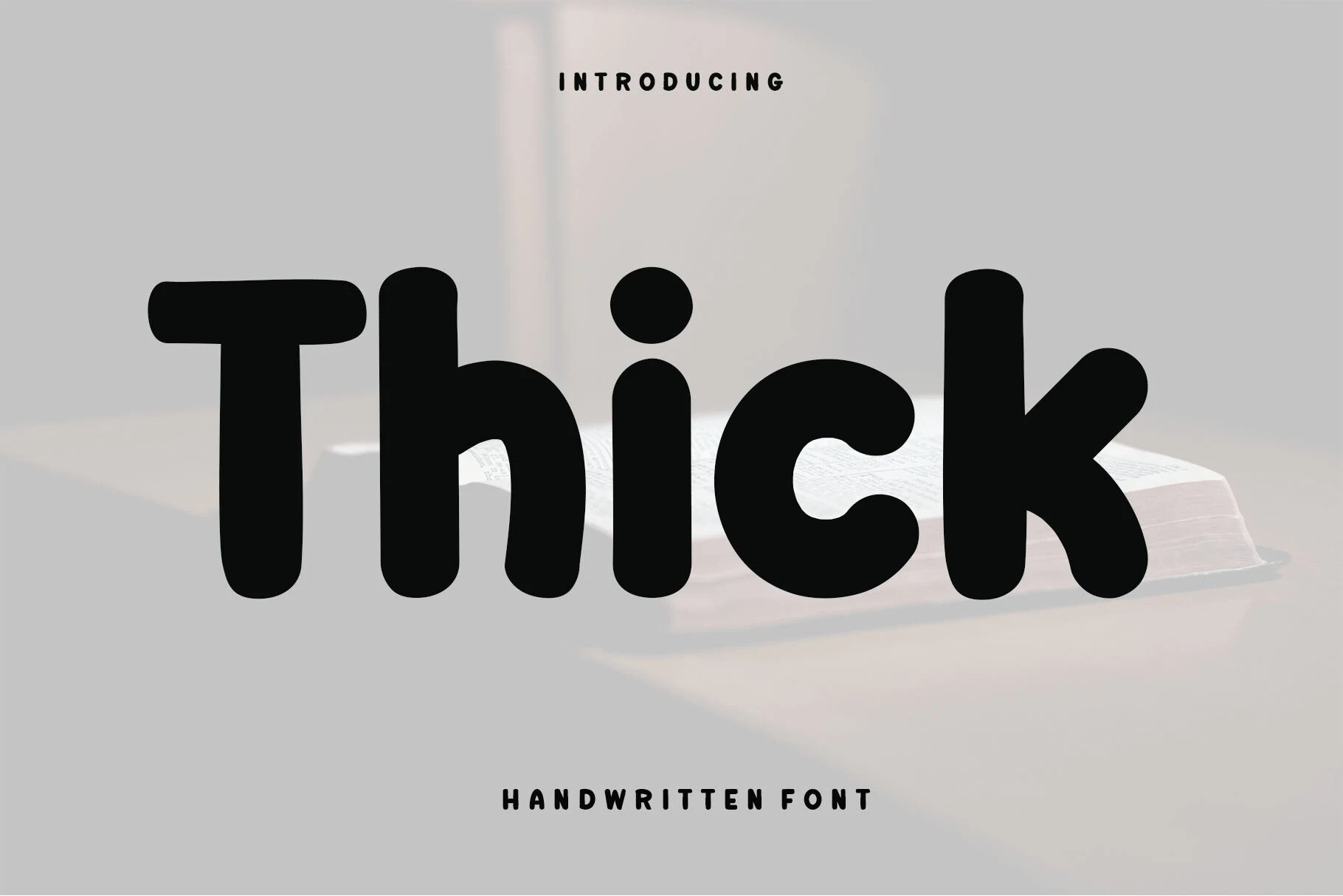 Thick Font preview in bold black rounded handwritten lettering