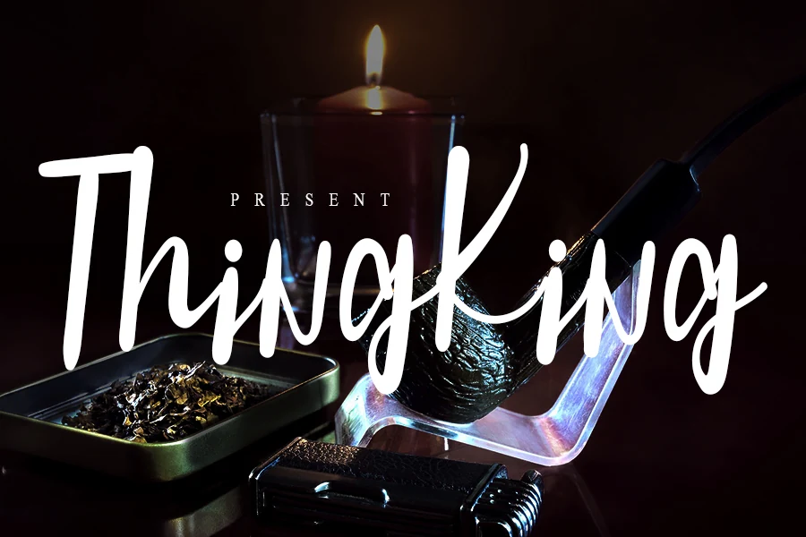 Thing King Font preview in bold white casual handwritten lettering with tall strokes