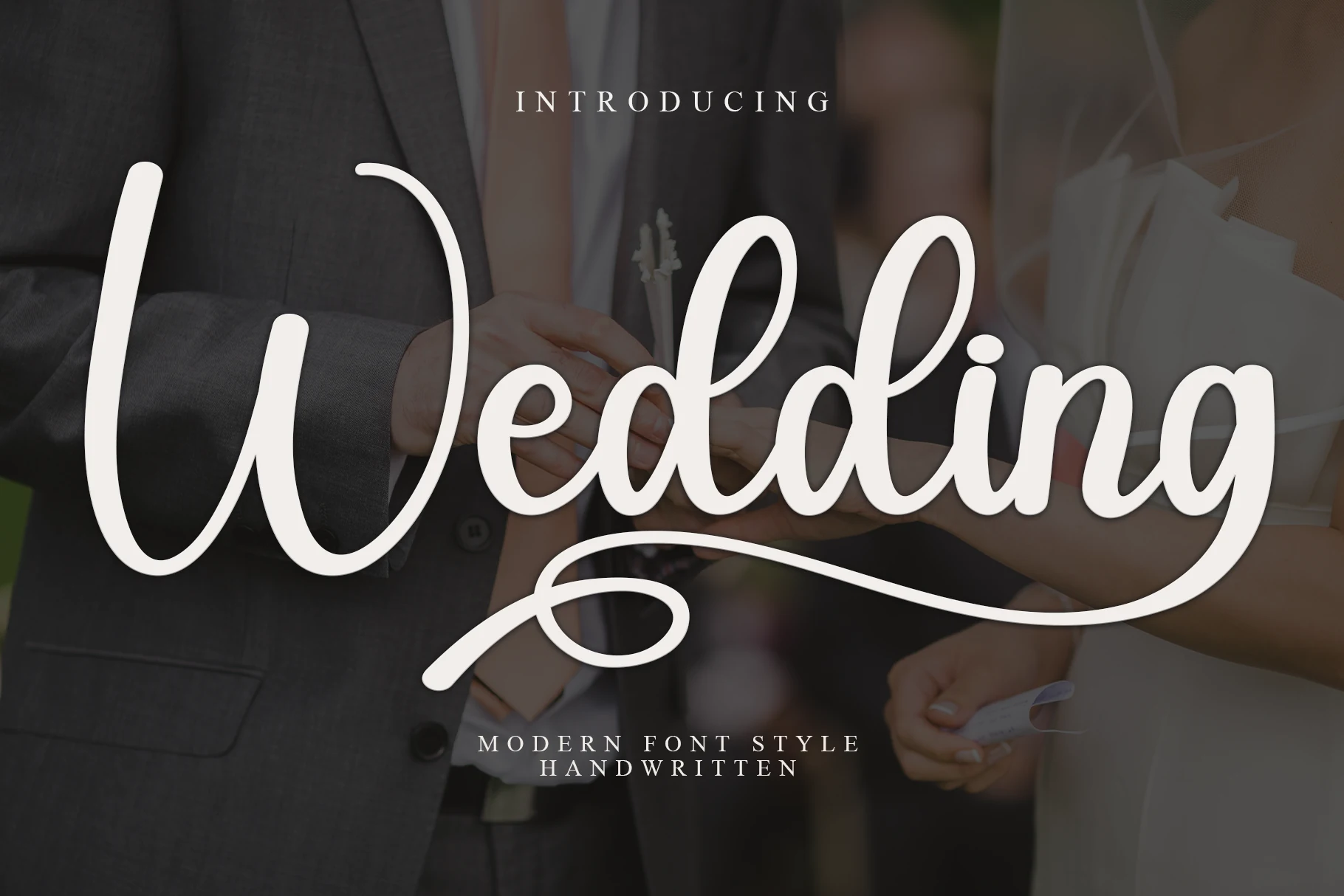 Wedding Font preview in bold white handwritten script with rounded strokes and a long underline swash