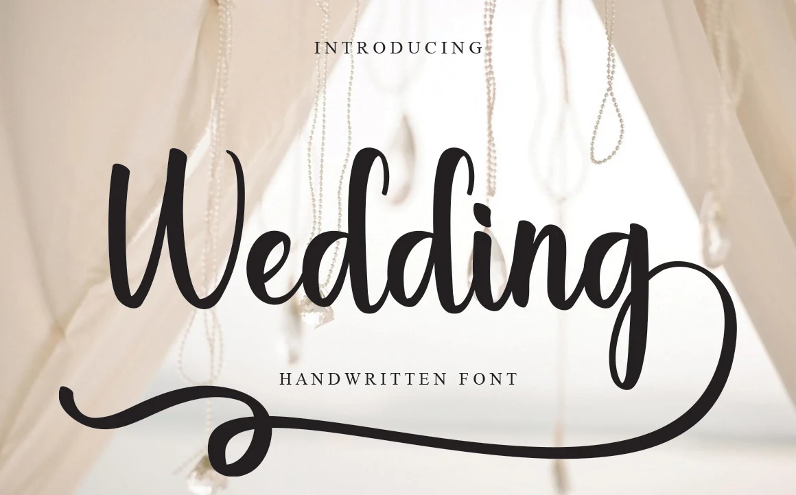 Wedding Font black flowing handwritten script with large loops and long swashes for wedding invitations