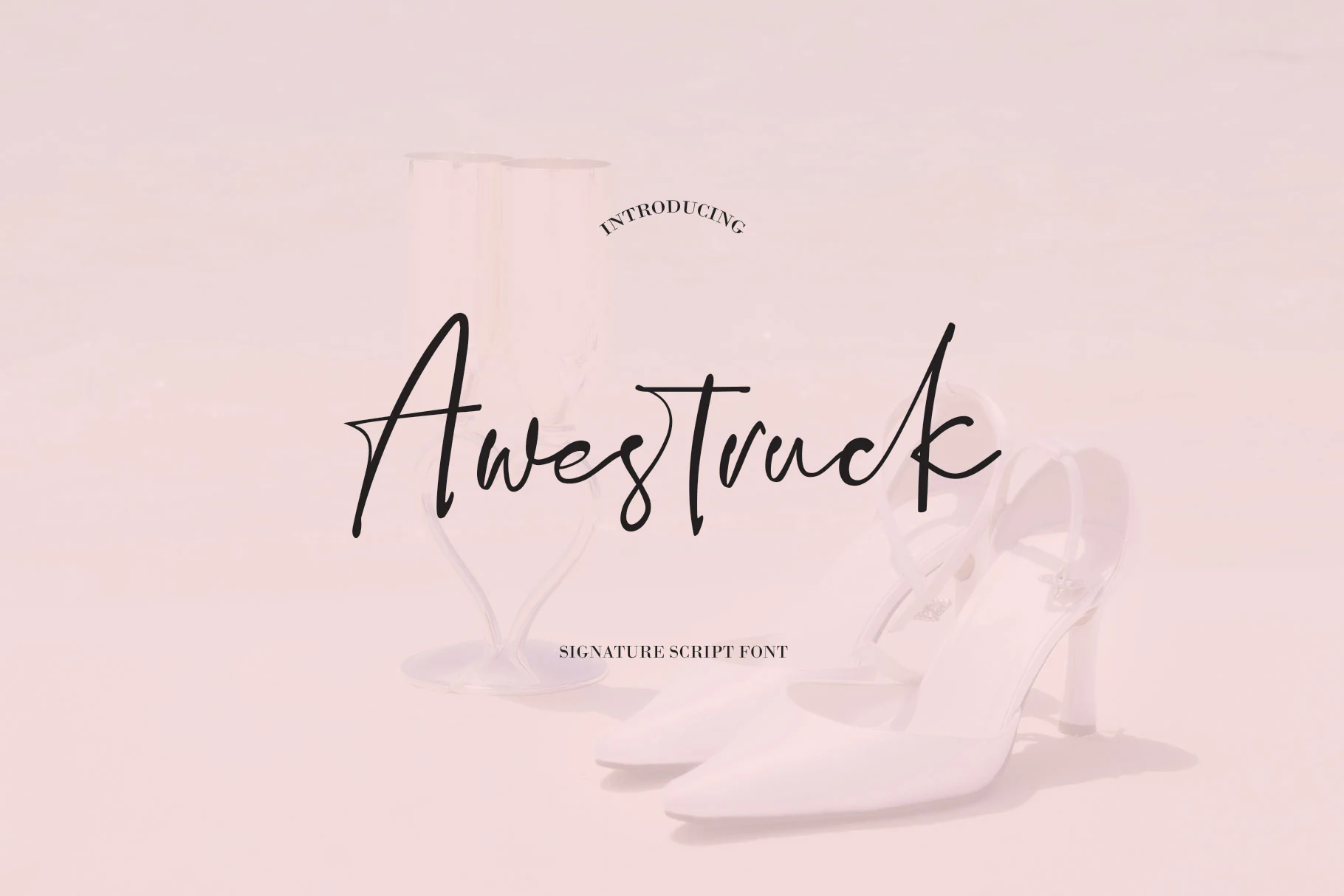 Awestruck Font featuring a right-leaning signature script with sweeping curves, varied stroke thickness, and elongated decorative tails.