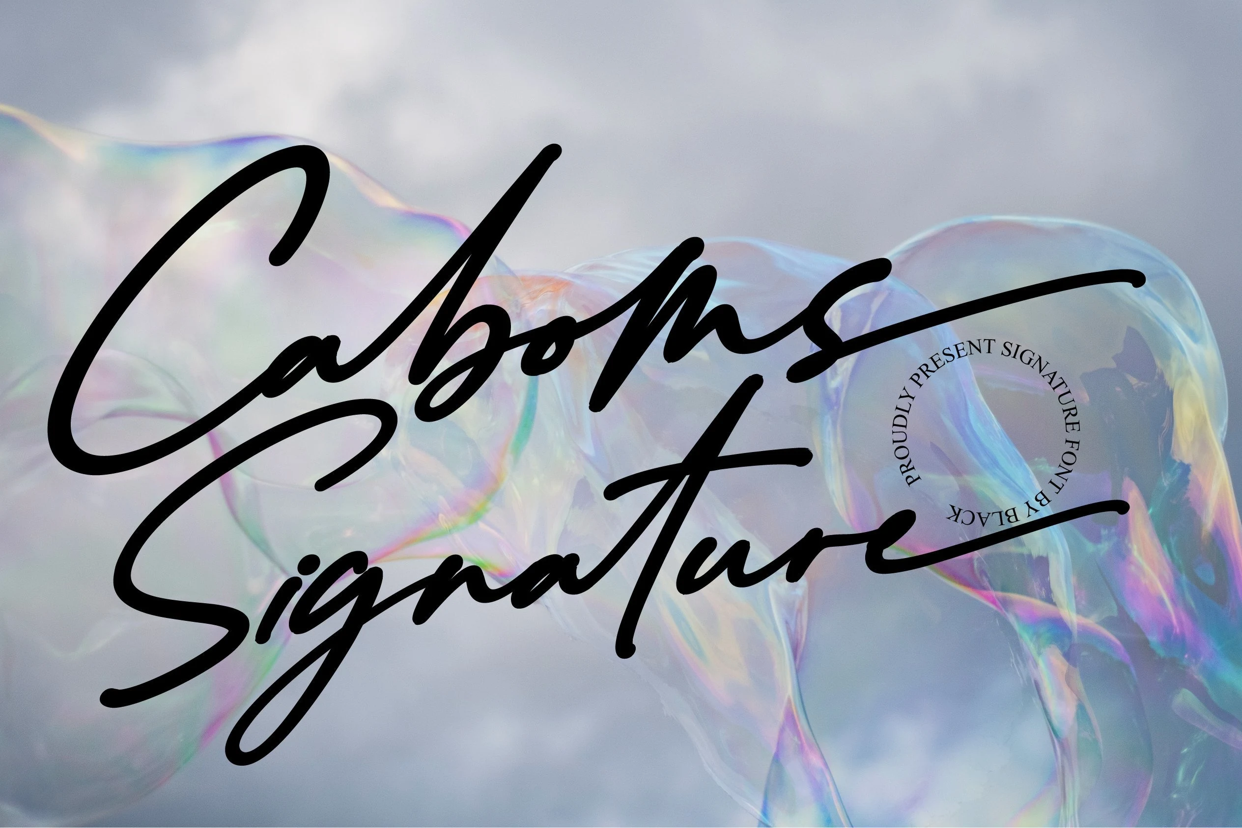 Caboms Font features connected, right-slanted script lettering with monolinear strokes and sweeping swash terminals.