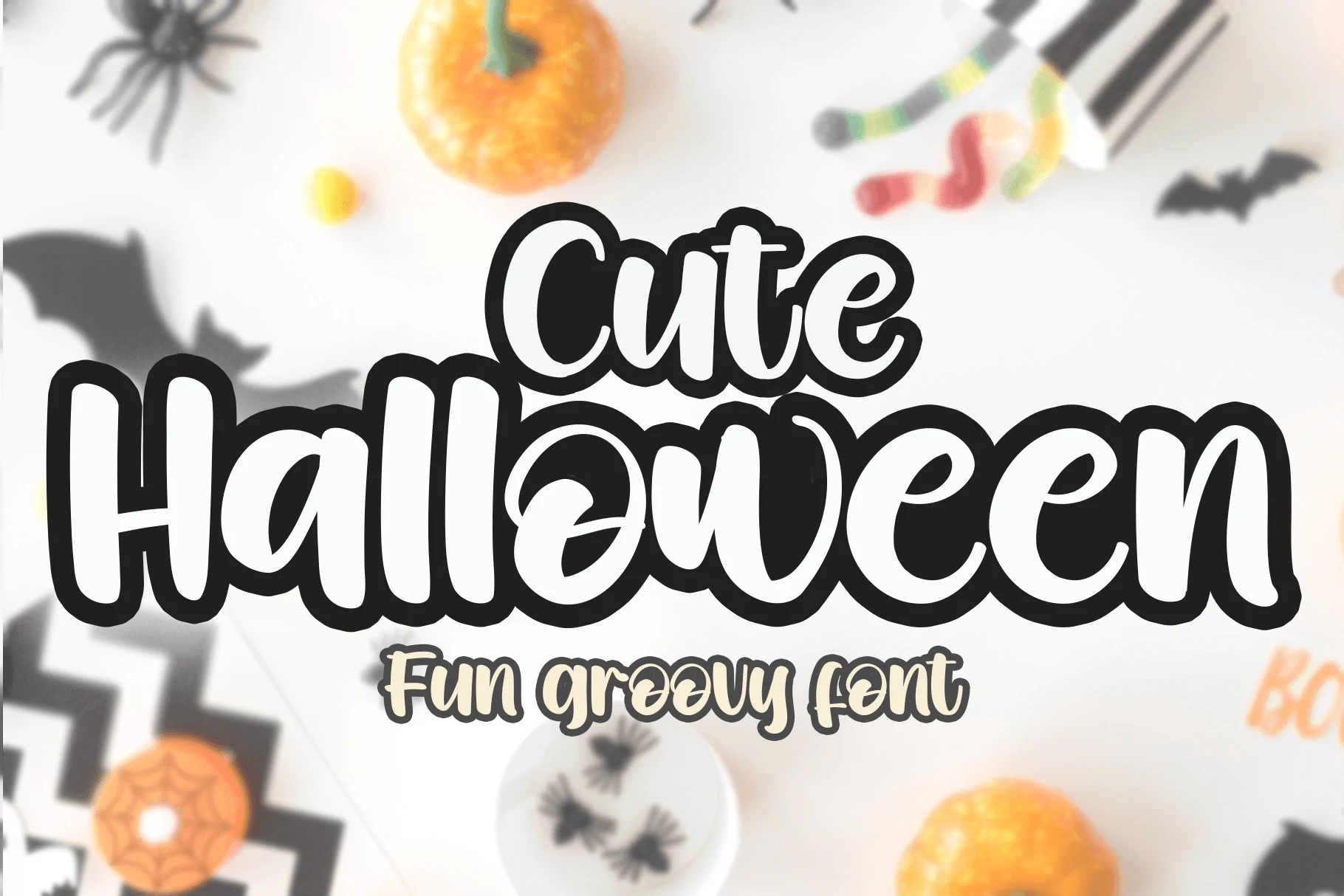 Cute Halloween Font with bold rounded script lettering, wide proportions, a bouncy baseline, and a thick black outline.