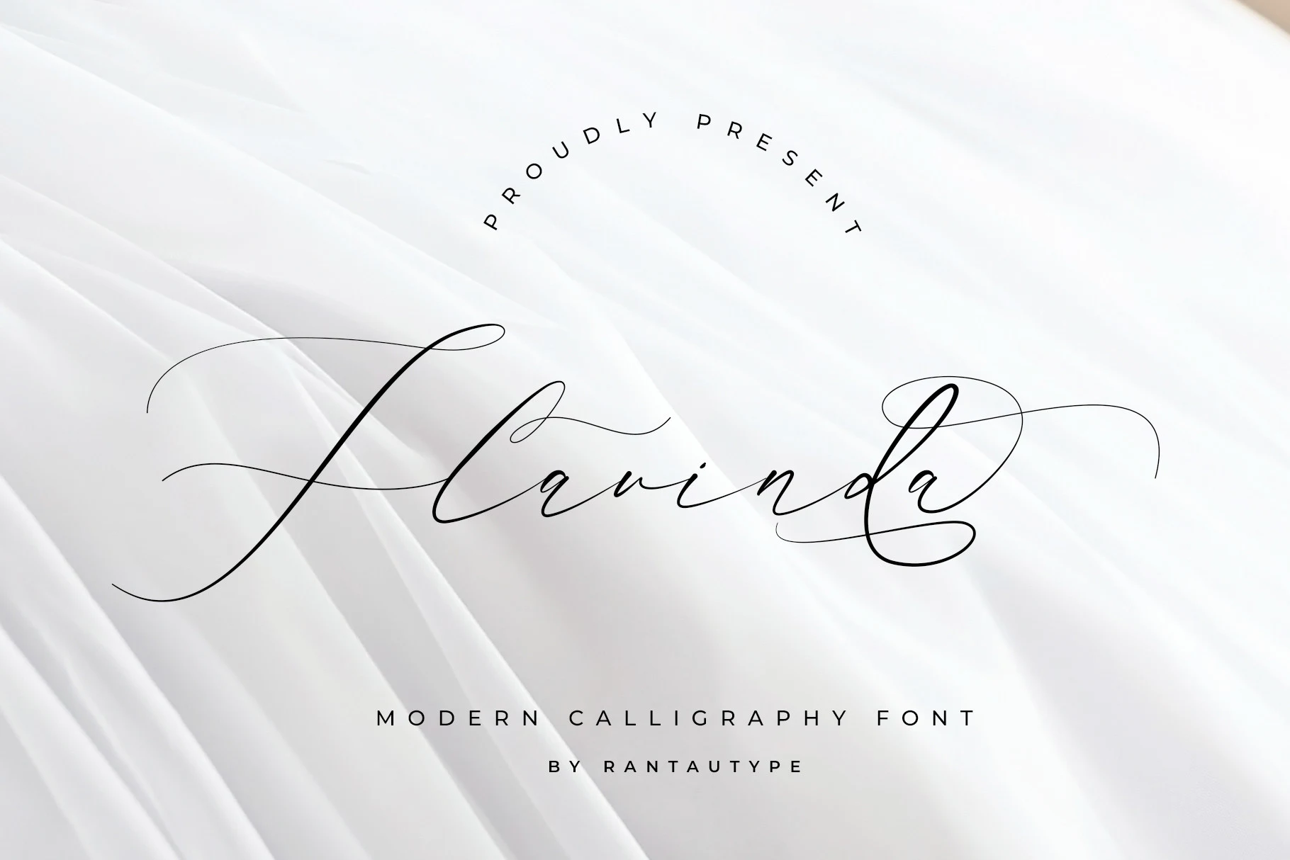 Flavinda Font featuring connected, high-contrast cursive letterforms with sweeping decorative swashes.