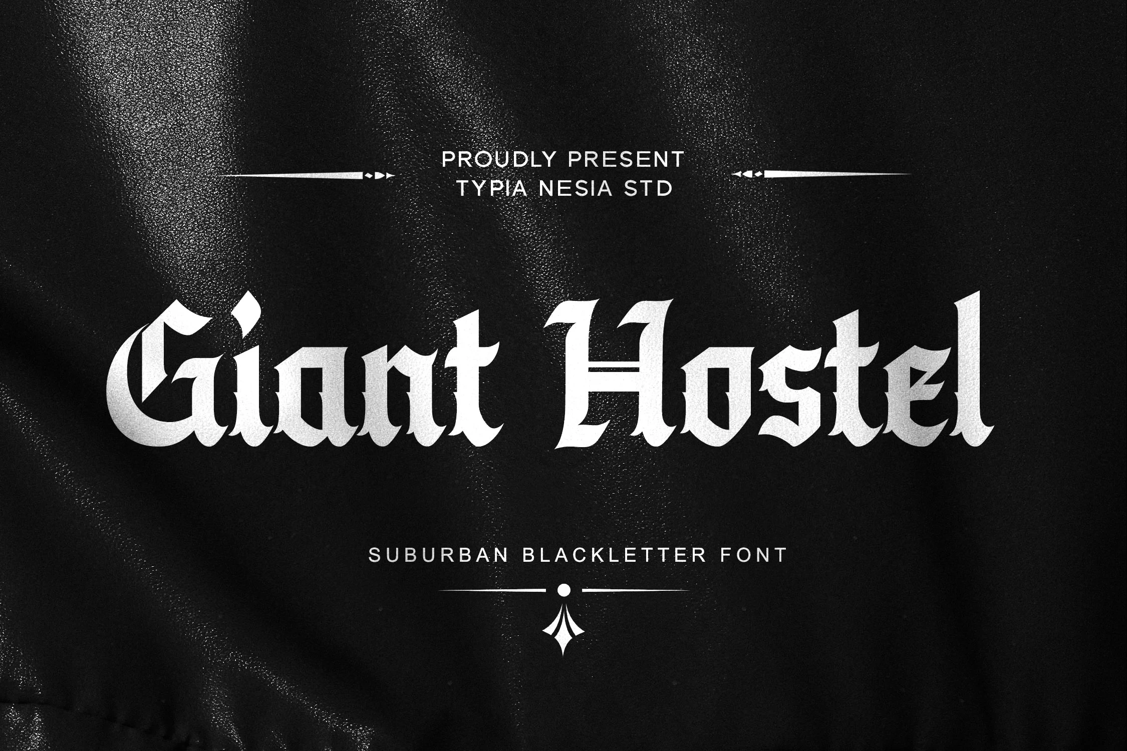 Giant Hostel Font featuring sharp angular Blackletter letterforms with high stroke contrast and spiked terminals.