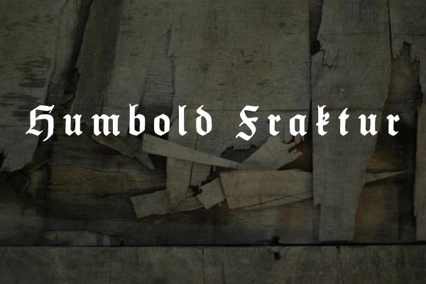Humbold Fraktur Font showing dense angular blackletter characters with pointed terminals and ornamental serif structures.