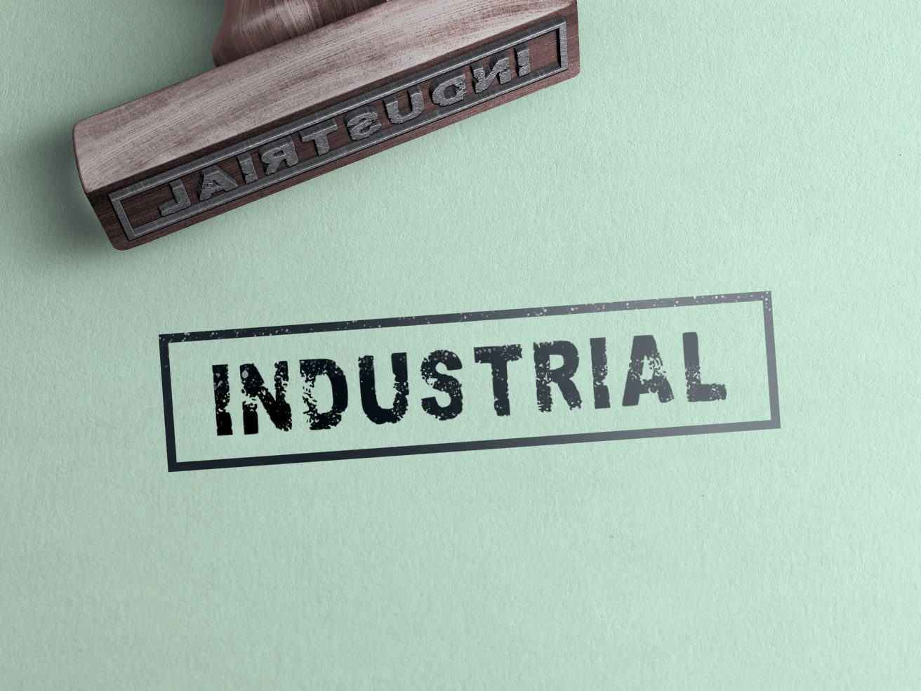 Industrial Font in a bold, condensed sans-serif style with blocky geometric letters and a textured stamped appearance.