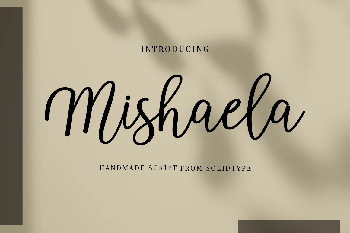 Mishaela Script Font features connected, upright cursive lettering with monolinear strokes and rounded terminals.