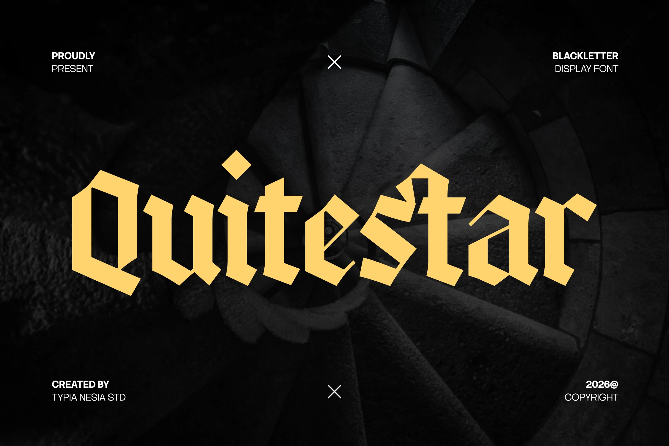 Quitestar Font in a heavy, angular blackletter style with diamond-shaped terminals and dense geometric letterforms.
