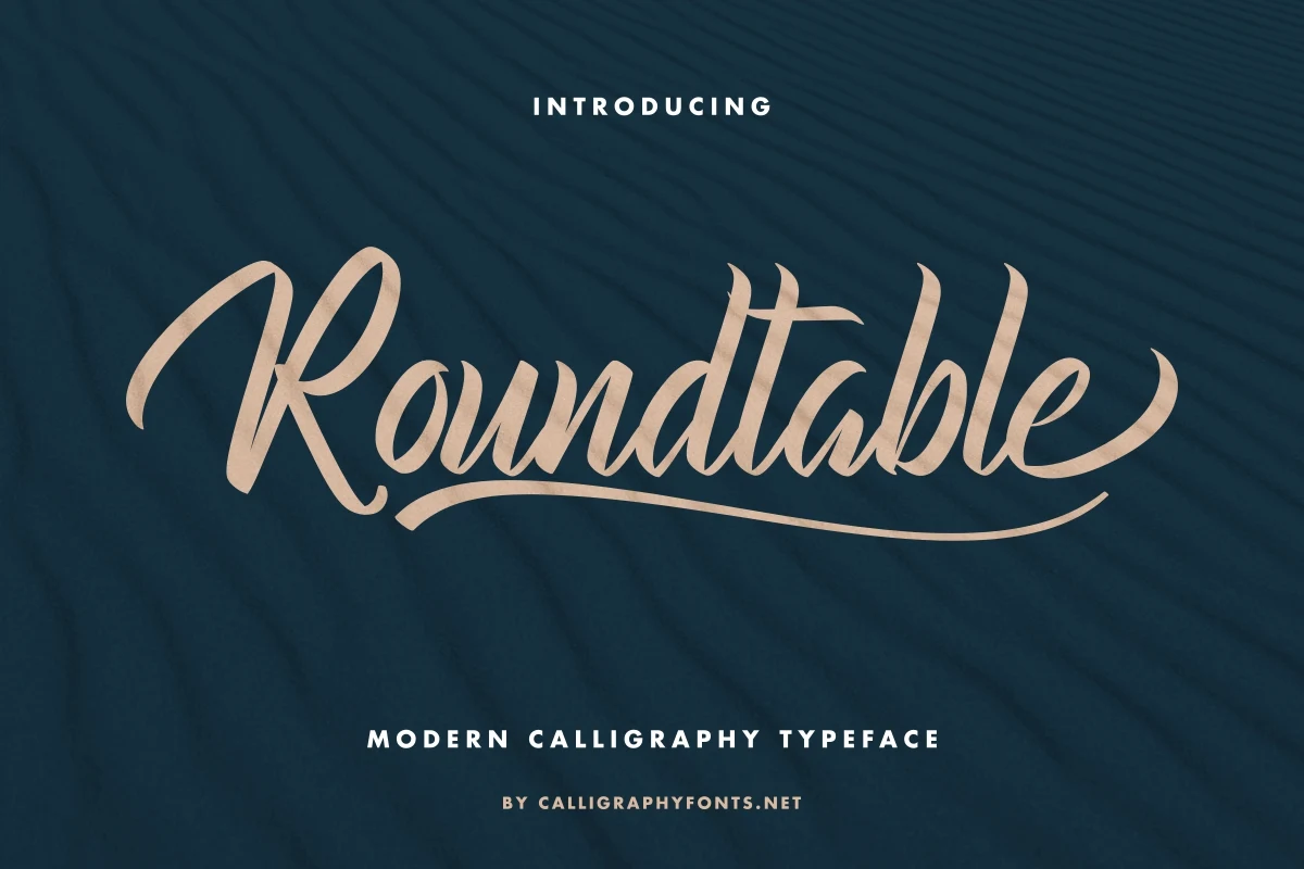 Roundtable Font displaying connected, high-contrast script letterforms with flowing swashes and a pronounced slant.