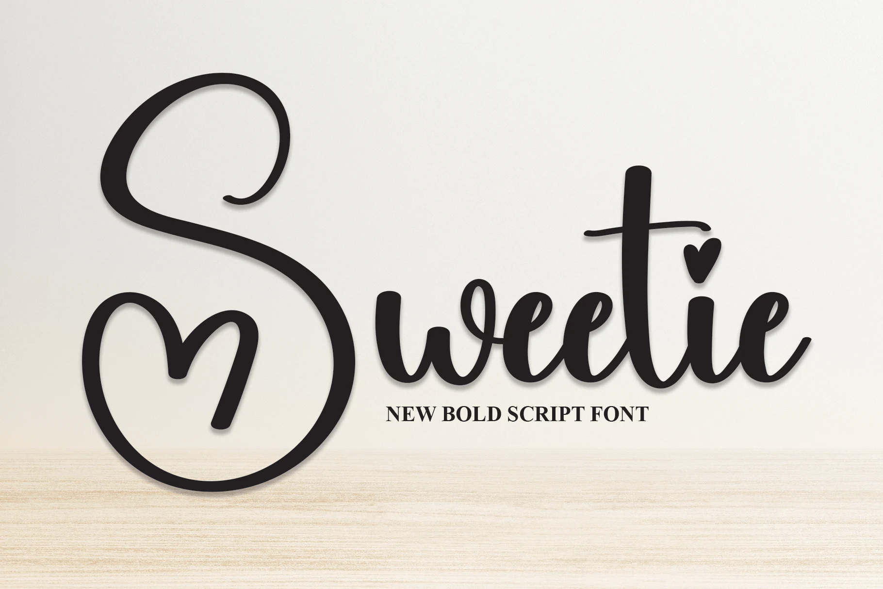 Sweetie Font is a bold connected script with elaborate swashes and heart-shaped details.